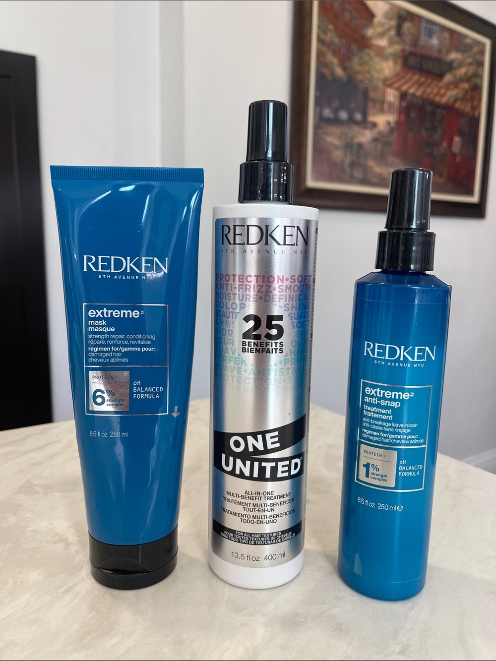 Redken “One United Multi-Benefit Leave-In Spray”, “Extreme Mask/Anti- Snap Treat